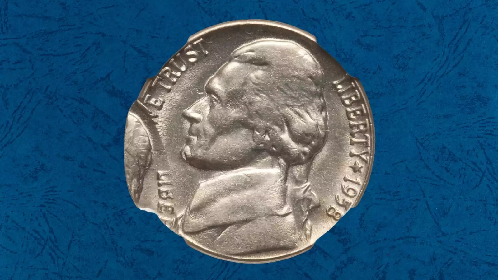 1958-D Jefferson nickel off-center strike error showing blank crescent rim and shifted Jefferson portrait