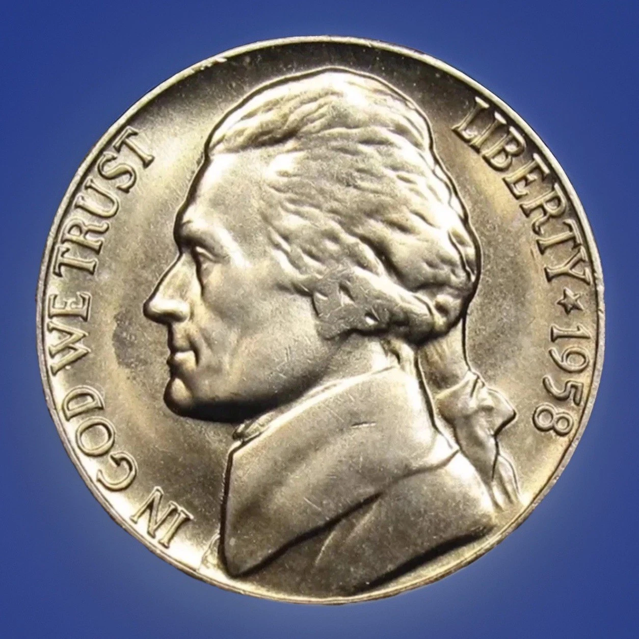Close-up of 1958 Jefferson nickel obverse showing doubling on LIBERTY inscription doubled die error